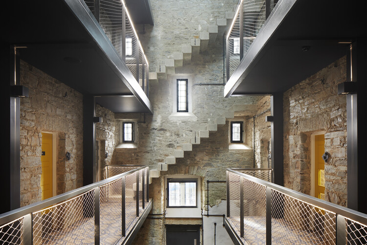 Bodmin Jail Hotel and Visitor Attraction  / Twelve Architects - Interior Photography, Stairs, Windows, Fence, Brick, Handrail, Beam